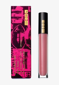 Tubetto di lucidalabbra rosa con cappuccio nero decorato con icone dorate, accanto a una confezione rosa e nera abbinata con stampa grafica di labbra e testo dorato.