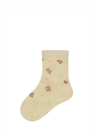 Gelber Baumwollsocke mit geripptem Bündchen und einem verstreuten Blumenmuster in Braun und Weiß. Glatte Textur, Standardknöchellänge.