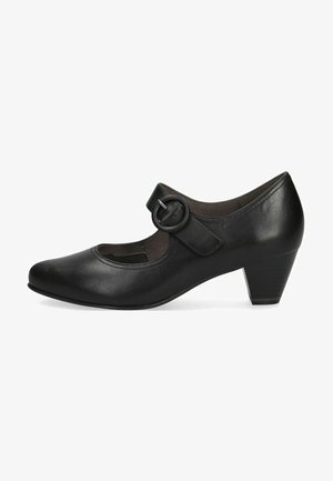 Black leather Mary Jane shoes with a round toe, adjustable strap featuring a circular buckle, and a modest block heel.