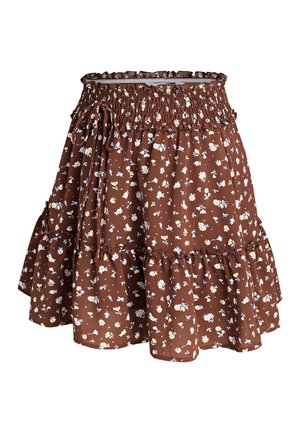 Jupe marron à volants avec taille élastique et petit imprimé floral blanc et jaune, avec un détail noué sur le côté.