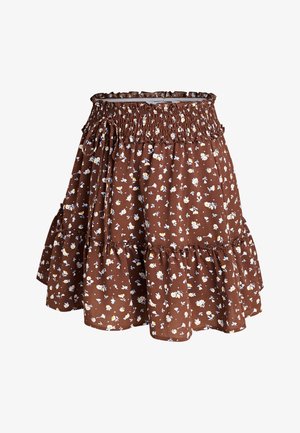 Falda marrón con volantes, cintura elástica y pequeño estampado floral blanco y amarillo, con detalle de lazo en un lateral.