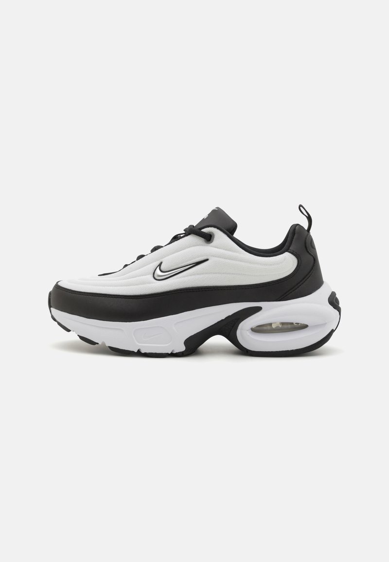 Nike sneaker featuring a white upper with textured fabric, black accents, a prominent midsole, and a visible air cushioning unit.