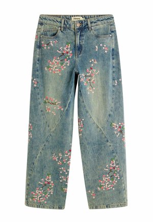 Light blue denim jeans with pink and white floral embroidery scattered on front and legs, featuring a button and zipper closure.