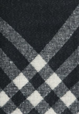 Tessuto a scacchi in bianco e nero con una trama testurizzata, caratterizzato da motivi a diamante e quadrati alternati. I bordi sono puliti e ben definiti.