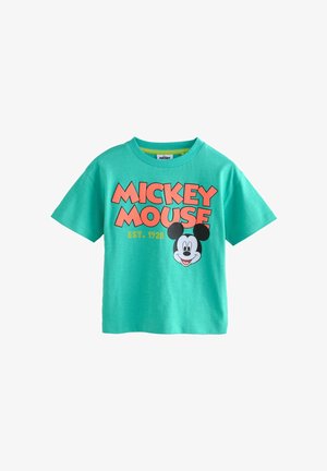 Roheline puuvillane T-särk lühikeste varrukatega, millel on suur graafika Mickey Mouse'i näost ja tekst "MICKEY MOUSE EST. 1928."
