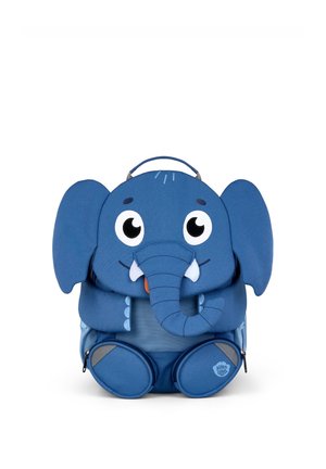 Blue children's backpack designed as a smiling elephant with large ears, a trunk, two tusks, big eyes, and front zipper pockets shaped like feet.