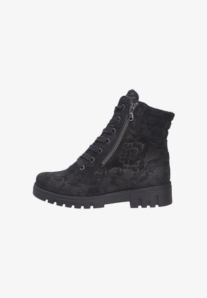 Bottines en suède noir avec un motif floral, à lacets à l'avant, fermeture éclair sur le côté et semelle à crampons épaisse pour une meilleure traction. Tige texturée et col rembourré.