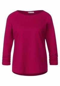 Fuchsia långärmad skjorta med rund hals, tillverkad av texturerat tyg, med rynkade ärmslut och en svängd nederkant för en avslappnad passform.