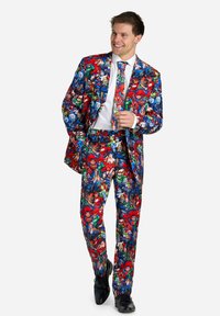 Colorful superhero-patterned suit with red, blue, and green hues; includes matching tie. Made from a smooth fabric, tailored design.