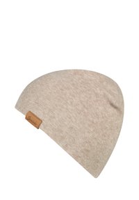 Beige knitted beanie hat with a rounded shape, featuring a small leather tag on one side. Soft texture and subtle pattern throughout.