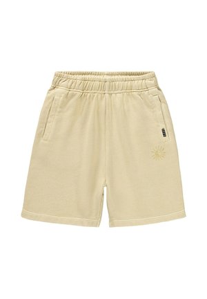 Beige katoenen korte broek met een elastische tailleband, zijzakken en een zon-illustratie op het linkerbeen. Gladde textuur en eenvoudig ontwerp.