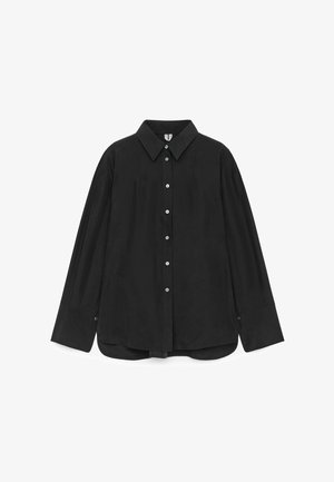 Black button-up shirt made of smooth fabric, featuring a collar, long sleeves, and a slightly curved hem with button accents.