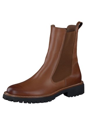Brown leather Chelsea boot with elastic side panels, rounded toe, and a black rubber sole featuring a tread pattern for grip.