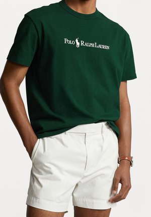 Groene katoenen t-shirt met wit "Polo Ralph Lauren" logo en een silhouet van een paard. Crew neck ontwerp met korte mouwen.