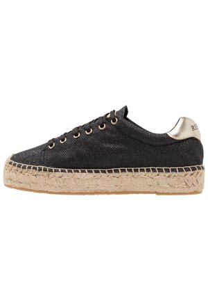 Black textile sneaker with a metallic accent at the heel, jute platform outsole, and six lace-up eyelets. Textured upper with subtle sheen.