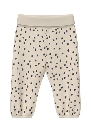 Beige Babyhose mit schwarzen unregelmäßigen Punkten, elastischem Bund und elastischen Bündchen an den Knöcheln.