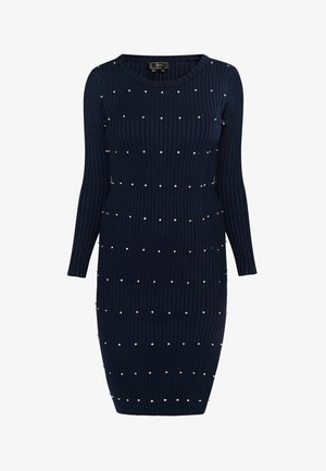 Navy rib gebreide jurk met lange mouwen, voorzien van verspreide metalen studs voor de afwerking en een aangesloten silhouet dat onder de knie valt.