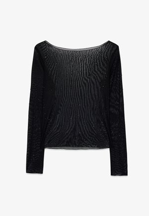Zwarte lange mouwen top van een transparante, textuurstof met kleine, glinsterende details doorheen. Rond decolleté en een ontspannen pasvorm.