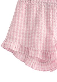 Rosa gingham-shorts med volangkant, tillverkade i ett lätt och strukturerat tyg. Designen innehåller alternerande rutmönster i ljus och mörk rosa.