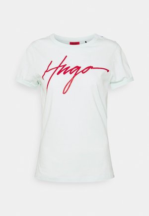 White cotton t-shirt featuring a red printed "Hugo" logo across the front, with a crew neckline and short sleeves.