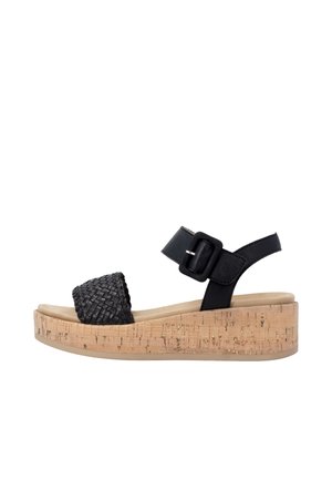 Schwarze Keilsandale mit geflochtenem Frontriemen, schwarzem Knöchelriemen mit Schnalle und korkstrukturierter Sohle.