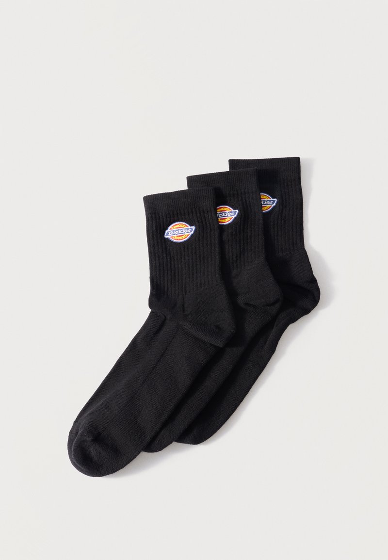 Three black crew socks with ribbed cuffs, each featuring a colorful circular Dickies logo on the upper part, laid flat on a white background.