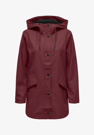 Red waterproof jacket with a hood, black snaps, and pockets. Smooth texture, mid-length design, and adjustable drawstrings at the neckline.