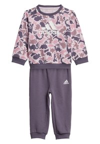 Ensemble de survêtement pour tout-petits Adidas avec un motif de dinosaure rose sur un haut violet clair et un pantalon violet foncé uni, avec des accents de logo.