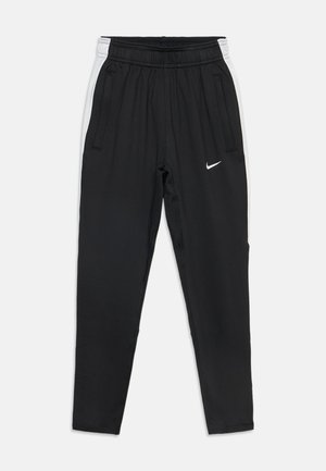 Czarne spodnie sportowe z białymi bocznymi paskami, elastycznym pasem, kieszeniami na suwak i małym, białym logo Nike na prawej udzie.