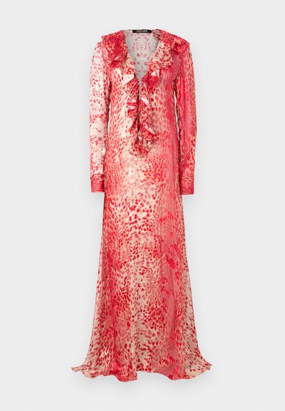 Long, sheer dress with a ruffled neckline in red and cream abstract pattern. Features long sleeves and a tie detail at the front.