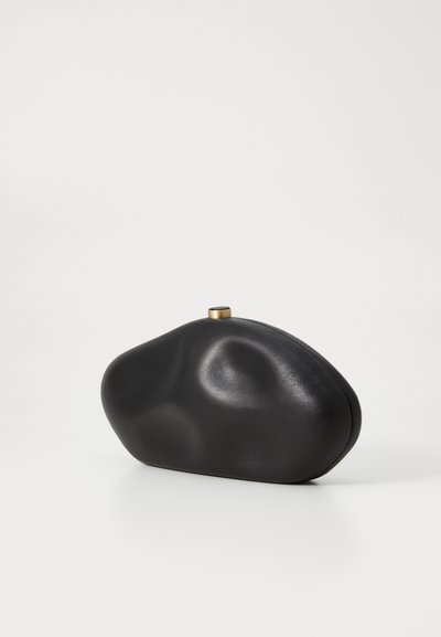 Black leather clutch with an irregular, smooth shape. Features a small gold-tone clasp and a sleek, minimalist design. No visible patterns.