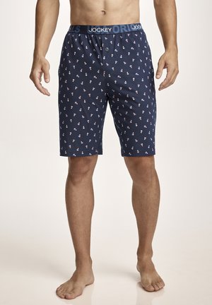 Men’s navy blue boxer shorts with small multicolored shuttlecock prints, branded elastic waistband, and front button fly.