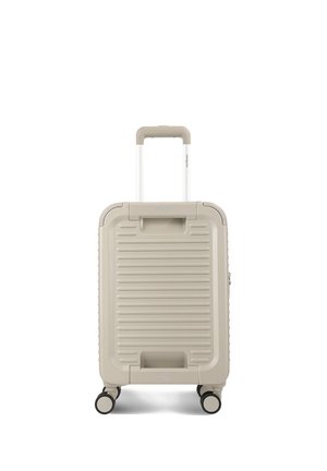 Petite valise rigide beige avec quatre roulettes et une poignée rétractable déployée à la verticale, vue de face sur fond blanc.