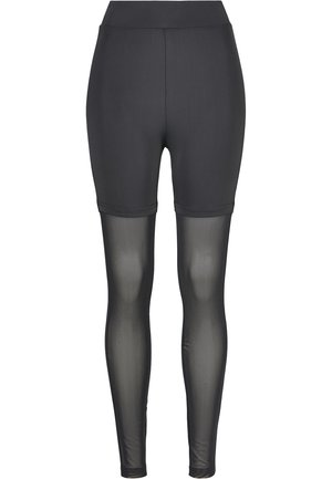 Shorts attivi neri con un alto pantalone in vita, caratterizzati da una parte superiore liscia e una parte inferiore in rete trasparente, progettati per comfort e traspirabilità.