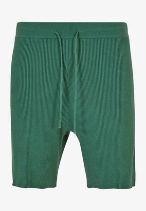 Zöld csíkozott rövidnadrág, puha anyagból készült, rugalmas derékkal és állítható zsinórral az optimális illeszkedés érdekében. Félcombig érő hosszal.