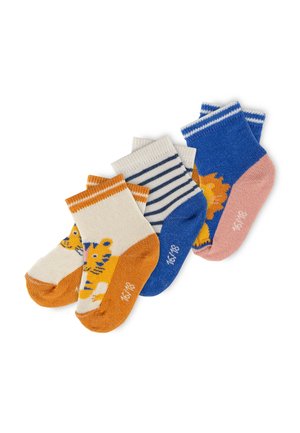 Four pairs of colorful toddler socks, featuring orange tiger, blue stripes, and blue lion designs, arranged on a white background.