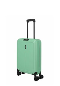 Helles grünes Hartschalentrolley mit matter Oberfläche, schwarzer ausziehbarer Griff und vier schwarzen Rollen. Verfügt über einen auffälligen Reißverschluss und ein Logo.