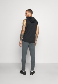 Under Armour Pantalones deportivos - pitch gray