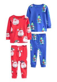 Deux ensembles de pyjamas pour enfants : un rouge avec des motifs de Père Noël, l'autre bleu avec des sapins de Noël et des pois colorés. Matière coton.