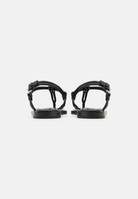 MICHAEL Michael Kors ASTRA THONG - Sandale cu baretă între degete - black