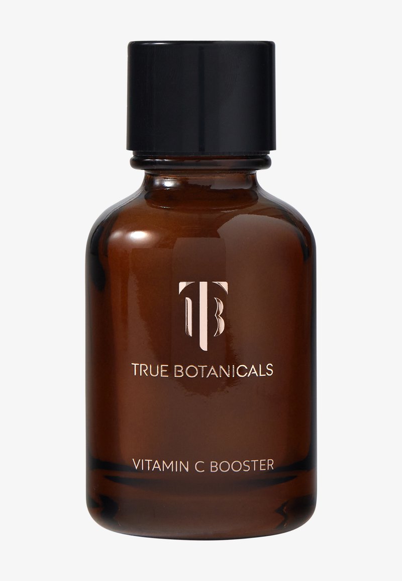 Bouteille en verre brun avec un capuchon noir, étiquetée "True Botanicals Vitamin C Booster." Présente un design minimaliste et un logo en relief.
