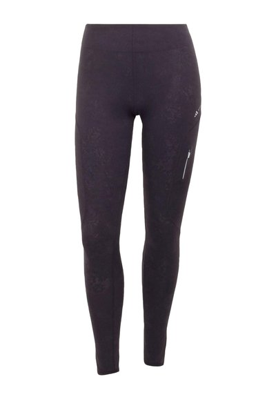 Schwarze, knöchellange Leggings mit hoher Taille und einer Reißverschlusstasche am rechten Oberschenkel.