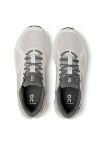 Light gray athletic shoes with mesh upper, contrasting dark gray accents, and logo. Features laces and padded collar for comfort.