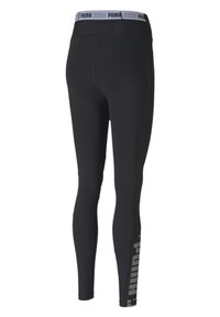 Czarne legginsy sportowe z wysokim stanem, wykonane z teksturowanego materiału, z wyraźnym logo "PUMA" w kontrastowym kolorze wzdłuż boku.