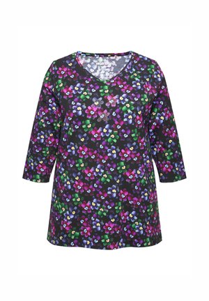 Blomstret V-hals tunika i sort stof med et farverigt mønster af lilla, pink, gul og grønne blomster. Trekvartærmer.