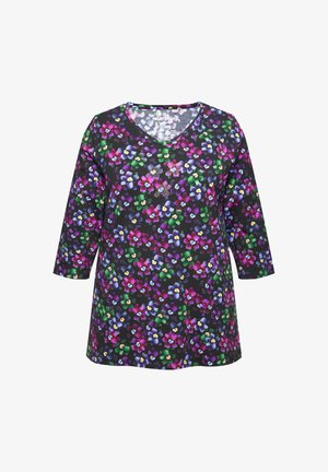 Blomstret V-hals tunika i sort stof med et farverigt mønster af lilla, pink, gul og grønne blomster. Trekvartærmer.