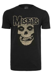Sort bomulds t-shirt med et stort, slidstærkt guld skull grafik med ordet "Misfits" ovenfor. Kortærmet og design med rund hals.