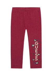 Bordeaux leggins med elastisk talje. "GUESS" logo trykt i guld, omgivet af mindre hjerteformer i marineblå og crème.