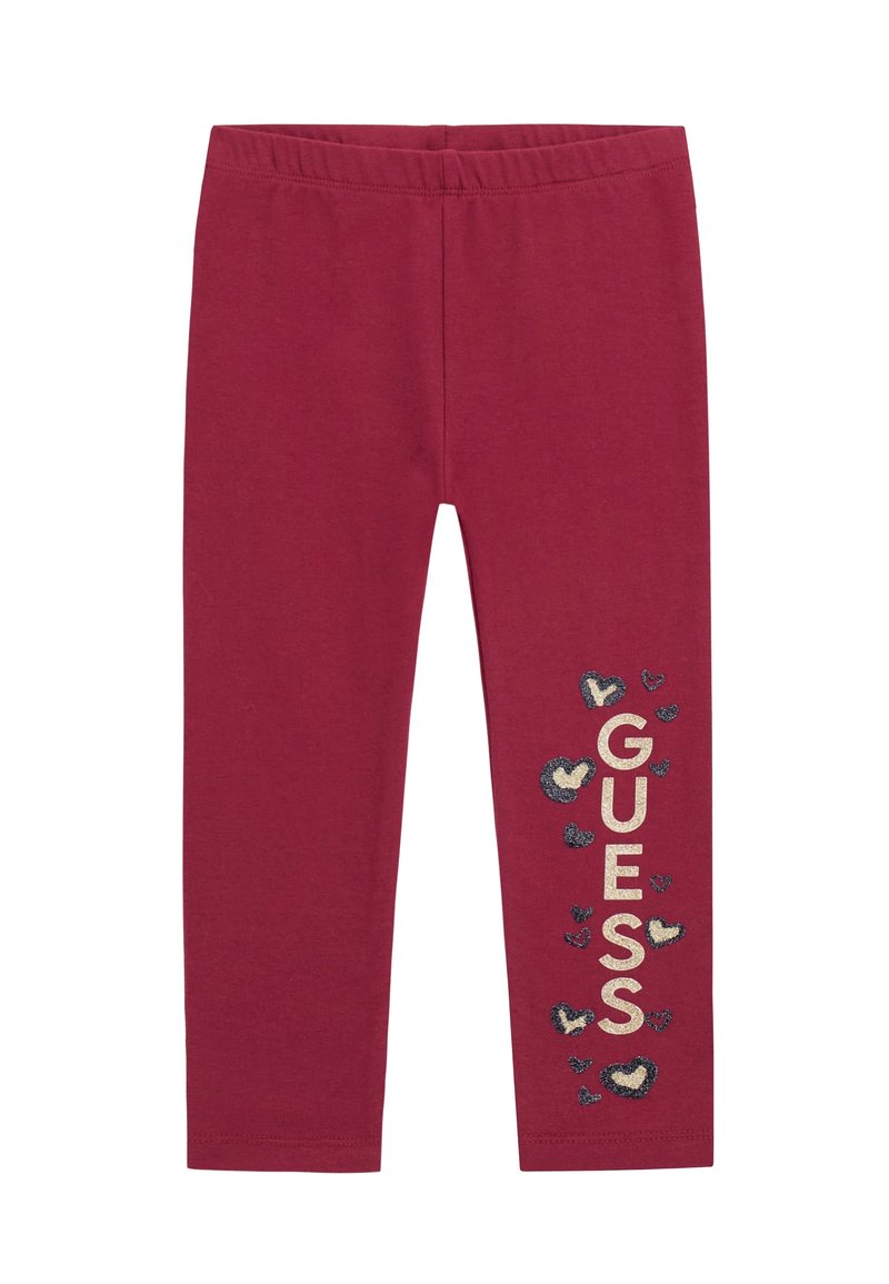 Bordeaux leggins med elastisk talje. "GUESS" logo trykt i guld, omgivet af mindre hjerteformer i marineblå og crème.