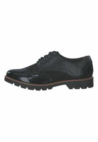 Chaussure brogue pour homme en cuir noir et daim, avec lacets à l'avant et semelle épaisse, vue de côté sur fond blanc.